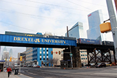 People walking under Drexel University underpass